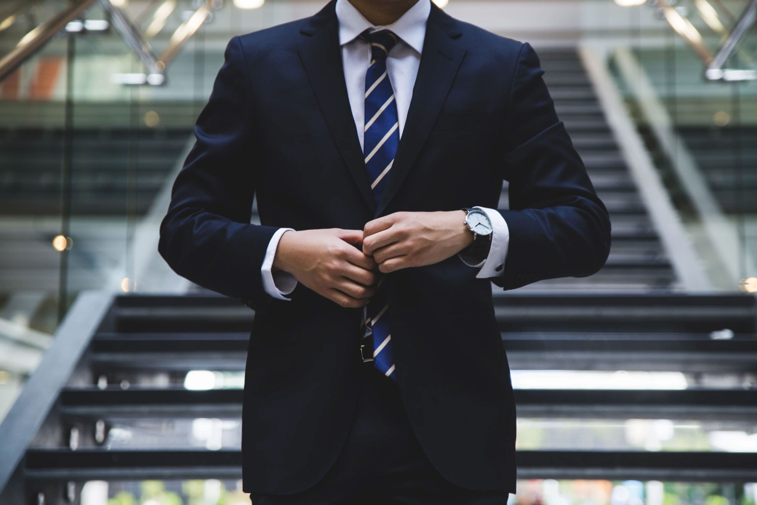 Man Buttoning Up Suit Jacket Man Buttoning Up Suit Jacket