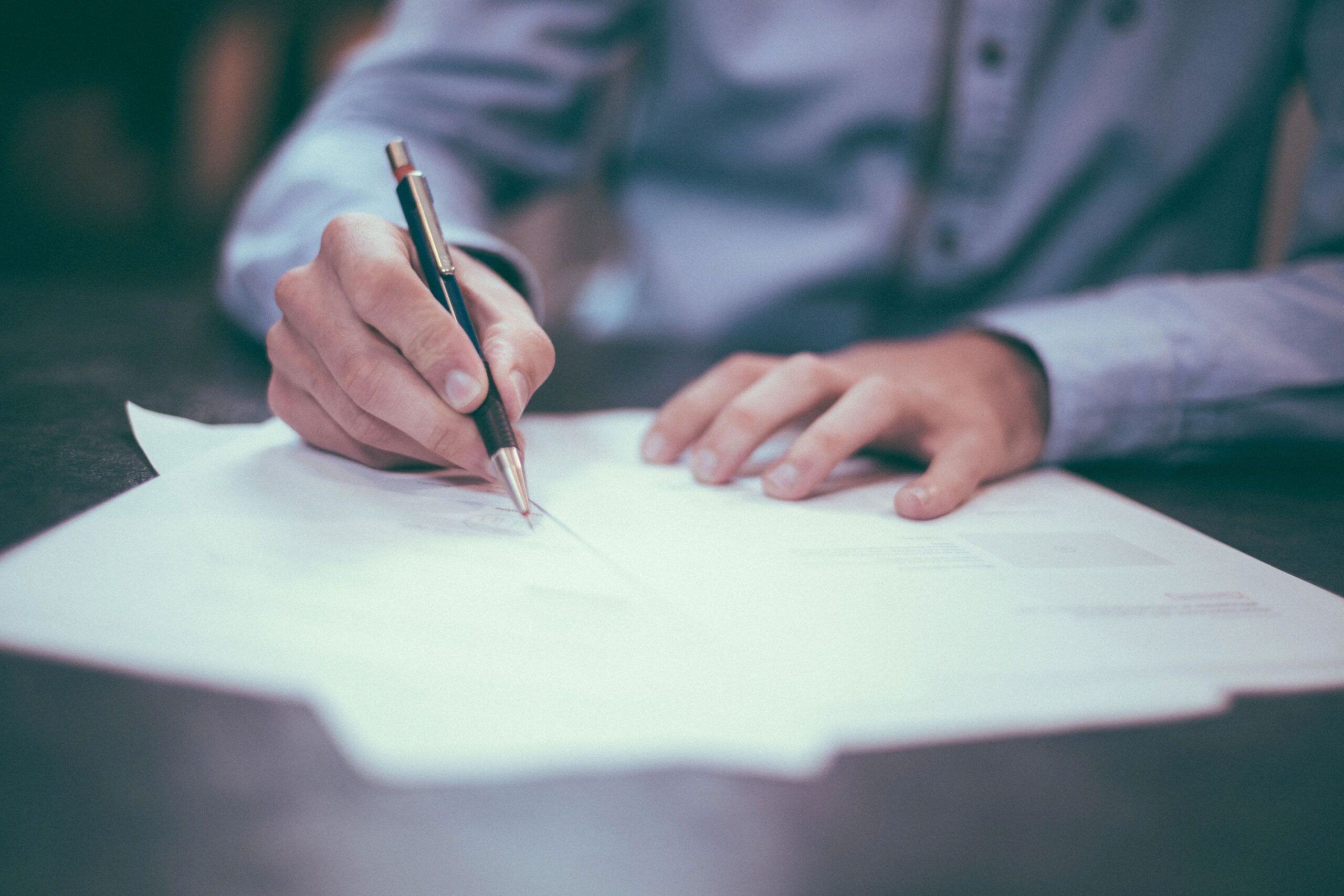 Man Filling Out Paperwork Man Filling Out Paperwork
